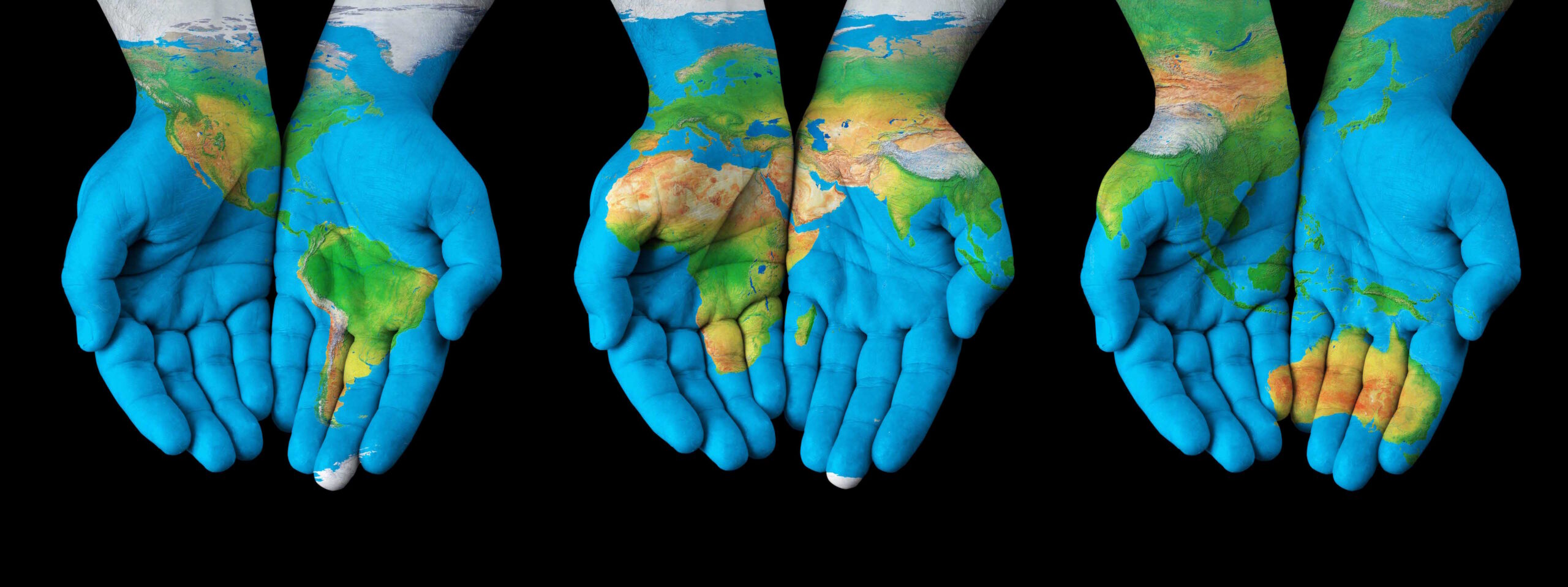 Archive photo showing hands holding a globe